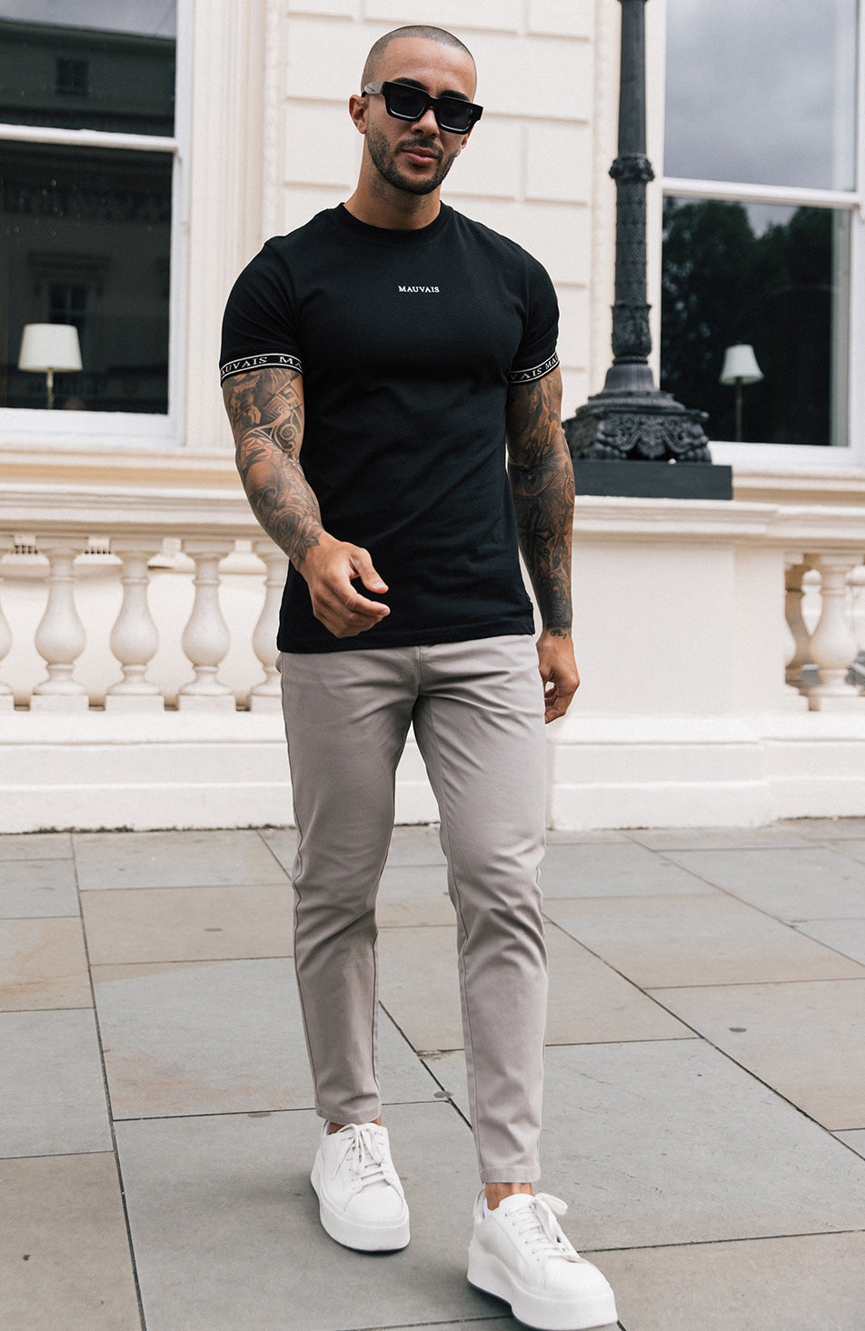 Taped Tee in Black worn with Taupe Chinos